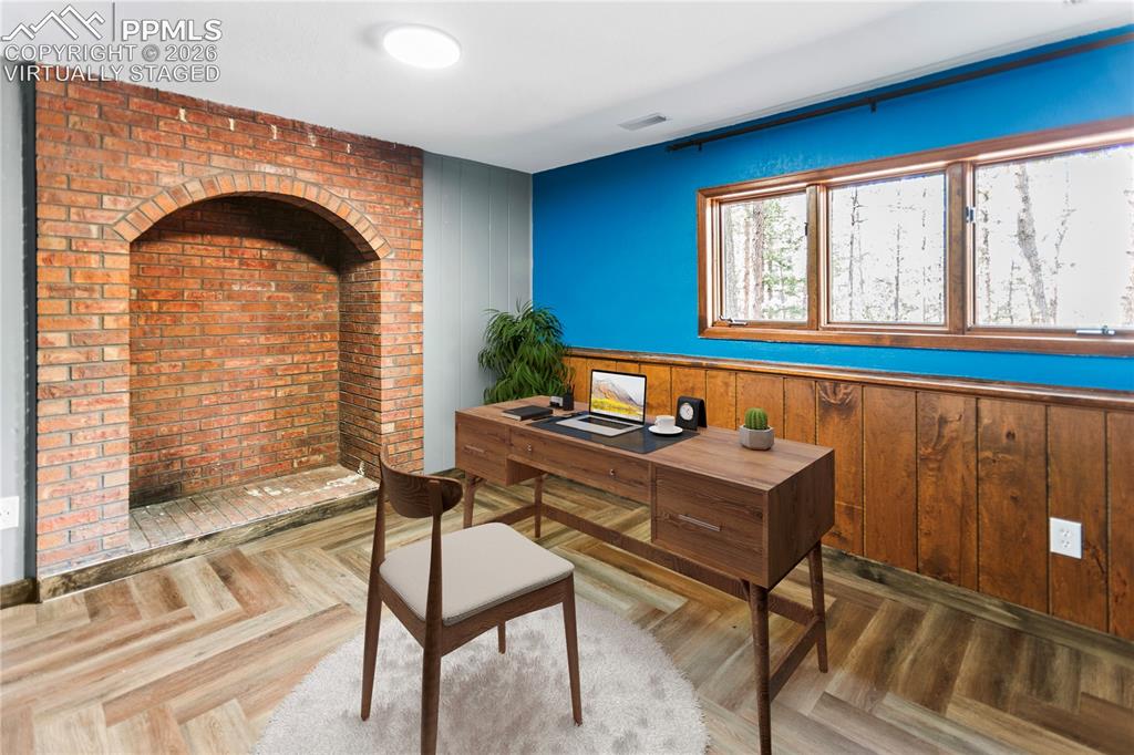 Image 17 of 34: Lower Level Family Room / Office - virtually staged