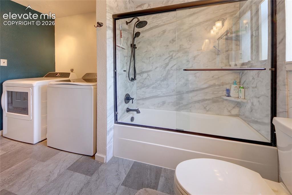 Image 13 of 26: Bathroom tub and shower combo