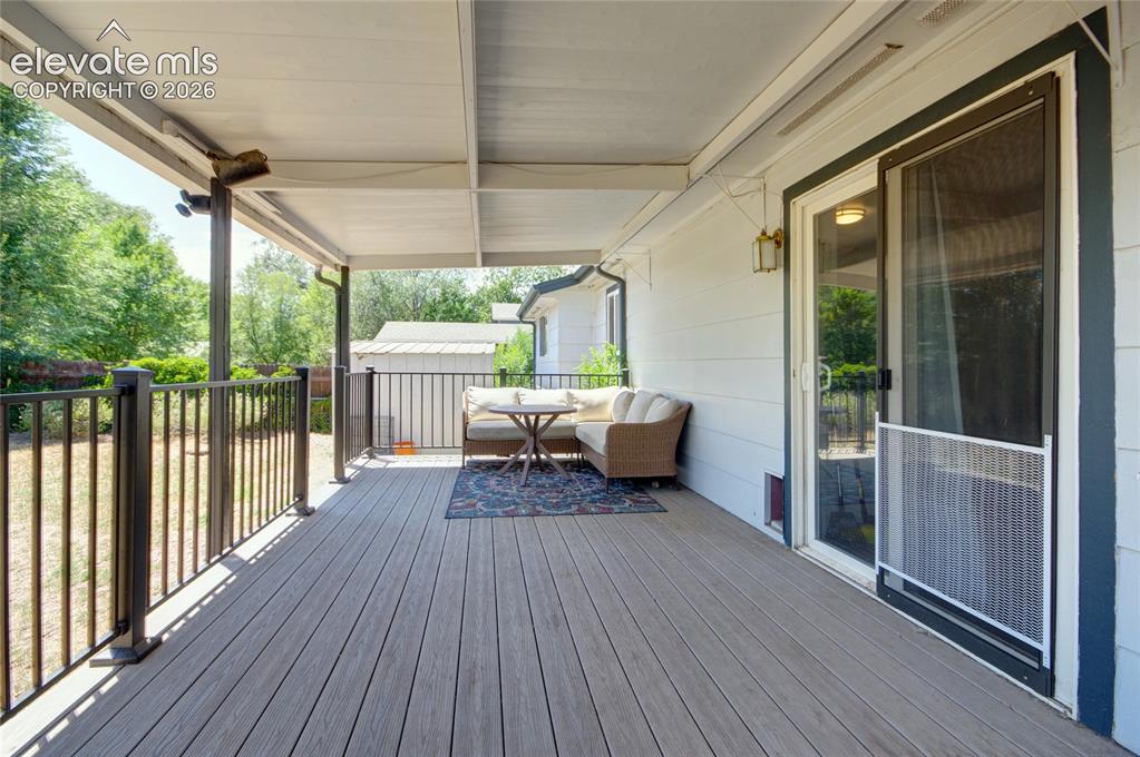 Image 22 of 26: Covered deck provides great entertaining space