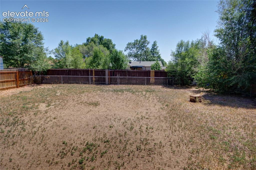 Image 23 of 26: Backyard is fully fenced