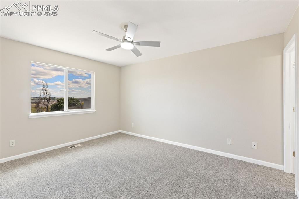 Image 36 of 50: Large primary bedroom off the living room