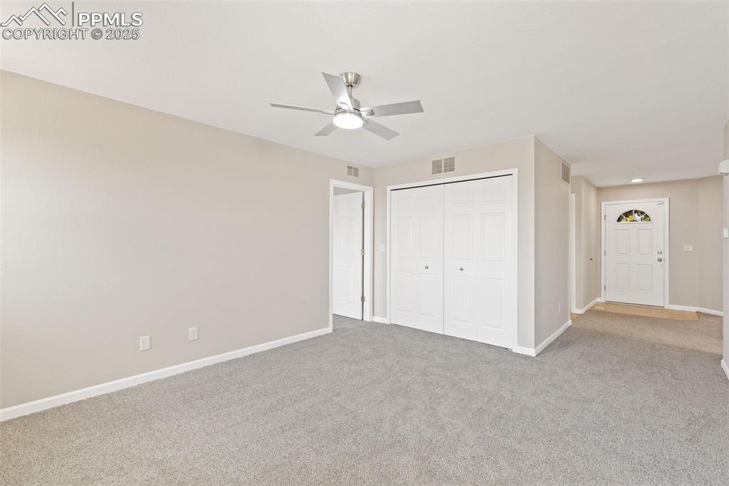 Image 4 of 50: Front entry leads to a large front bedroom and living room