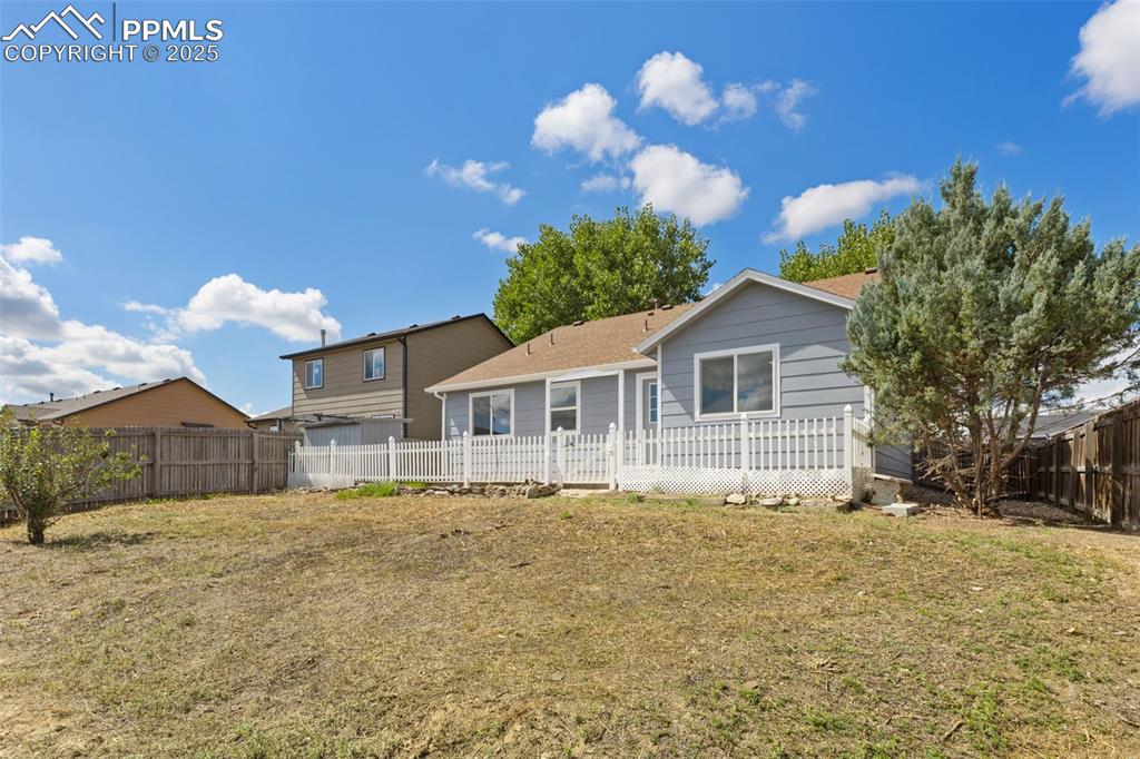 Image 40 of 50: Fully fenced back yard with no neighbors behind!