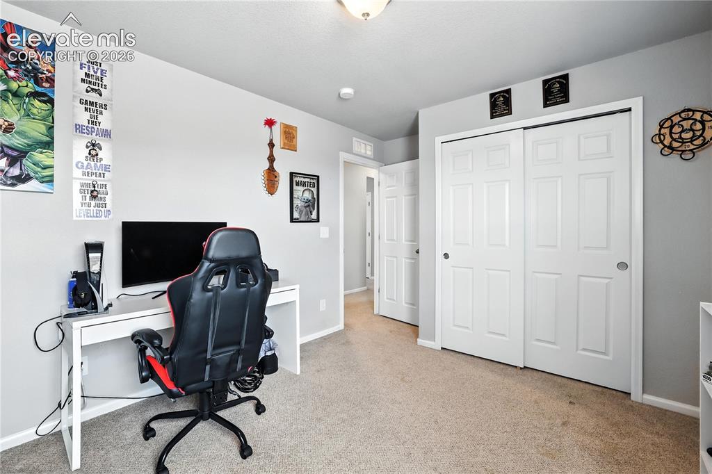 Image 31 of 42: Wall-to-wall carpeting with light gray walls and white trim