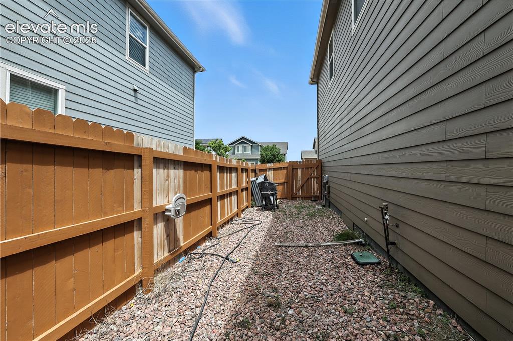 Image 39 of 42: Wood privacy fence with gate