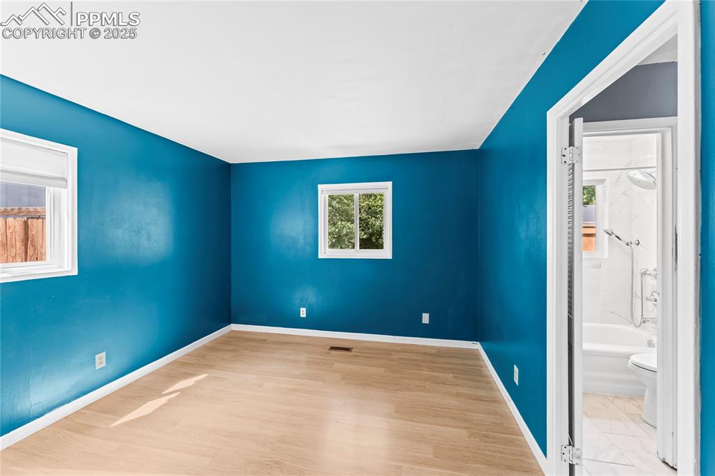 Image 10 of 27: Empty room featuring baseboards and light wood finished floors