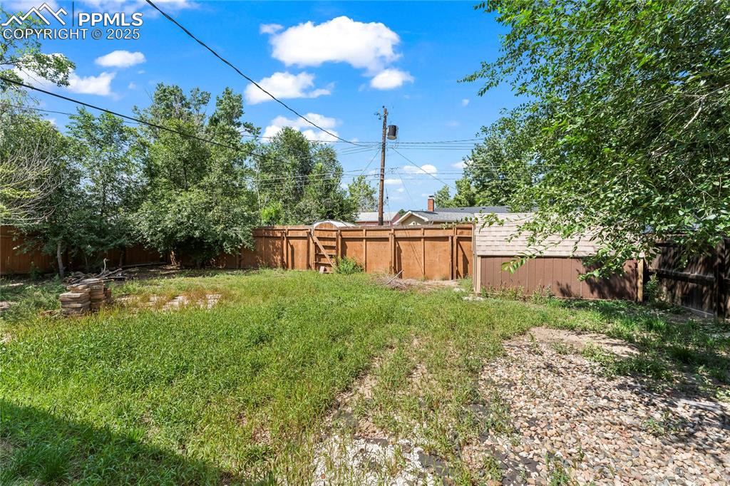 Image 22 of 27: View of fenced backyard