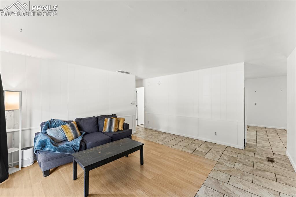 Image 3 of 27: Living room featuring wood finished floors