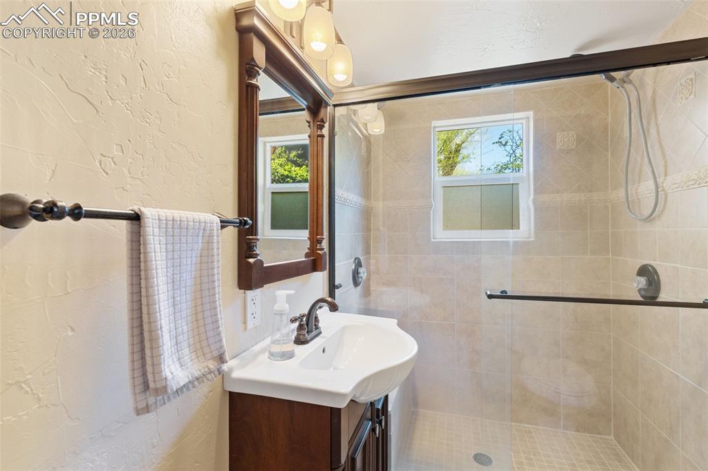 Image 13 of 35: lower level 3/4 bathroom