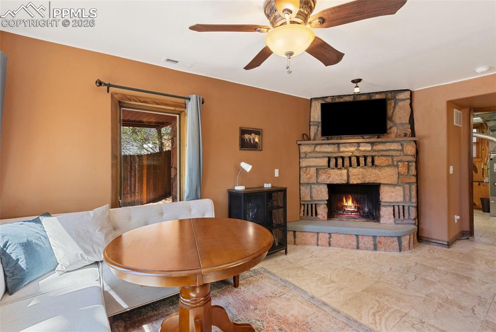 Image 6 of 35: main level family room with fireplace
