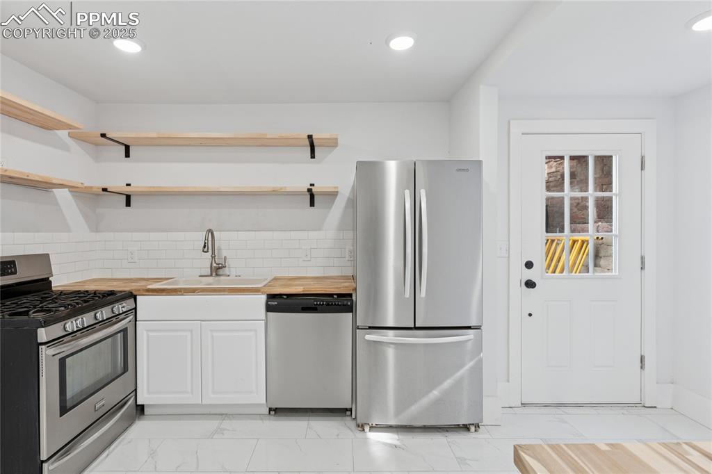 Image 16 of 45: Main-level flat kitchen