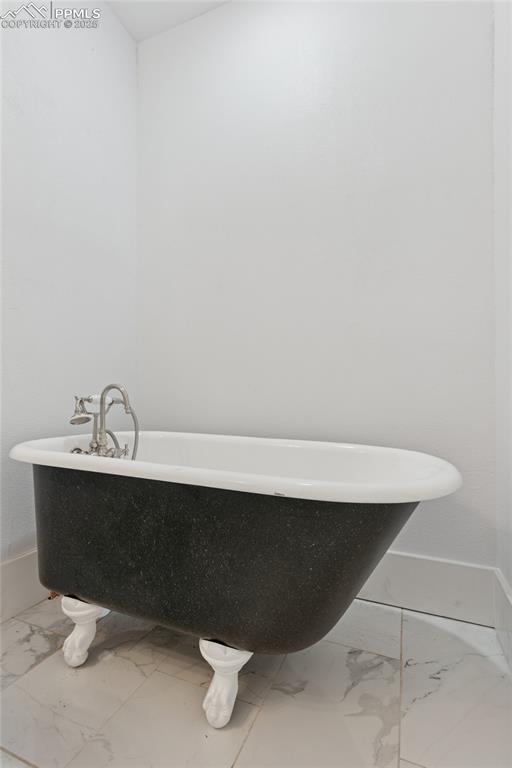 Image 20 of 45: Main-level flat 2nd full bath with clawfoot tub and shower attachment