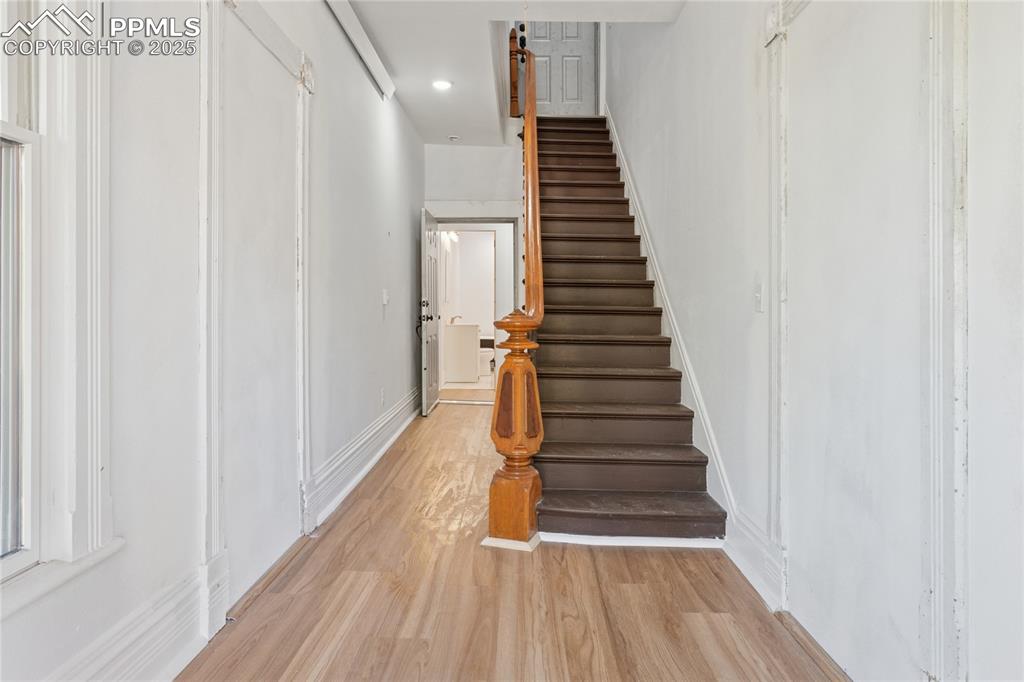 Image 7 of 45: Entry hall, period stairway to upper flat