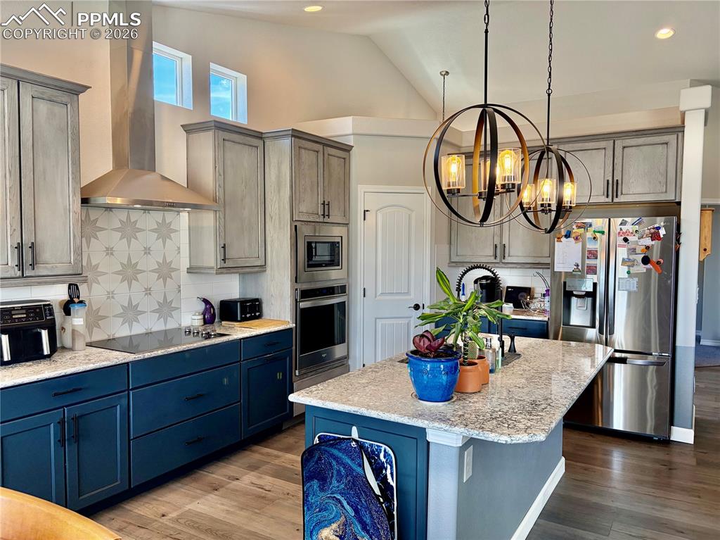 Image 12 of 44: Granite countertops, back splash and a pantry