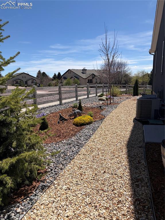 Image 42 of 44: Walkway along side of home