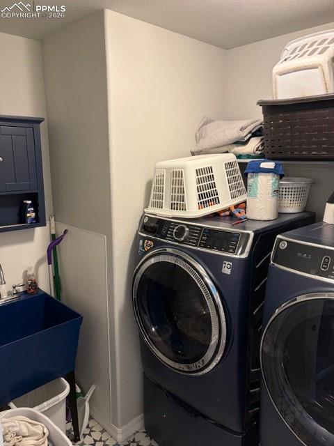 Image 43 of 44: Main level laundry room with sink
