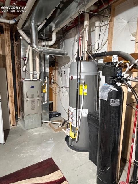 Image 44 of 50: Mechanical room with whole house humidifier and water softener system