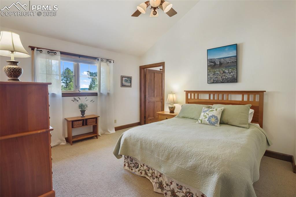 Image 22 of 50: Upper level guest bedroom with en suite bathroom