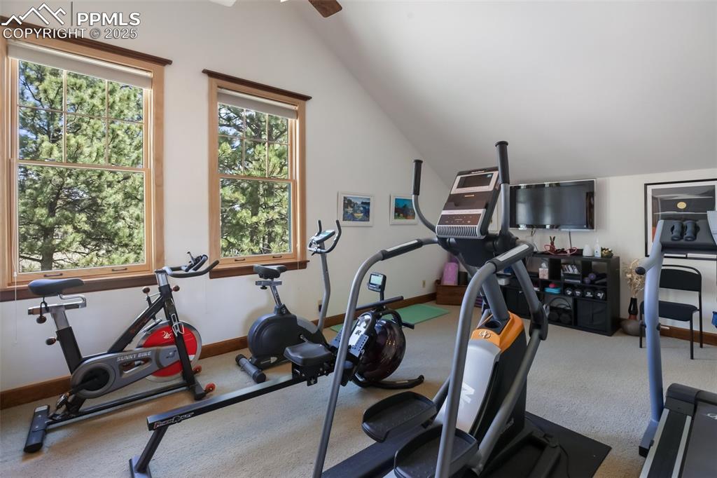 Image 33 of 50: Upper level apartment 2nd bedroom, now an exercise room, with bath attached