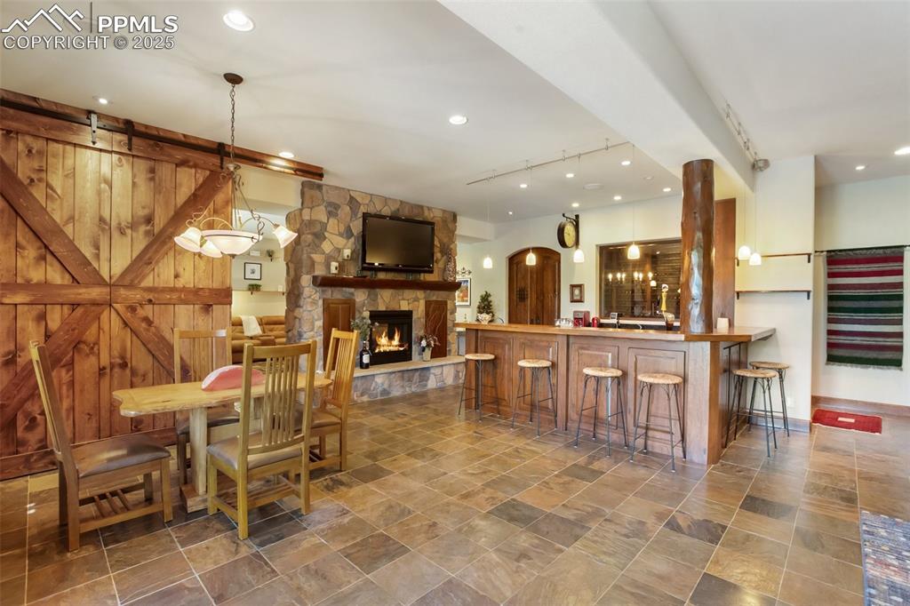 Image 34 of 50: Lower level family room and var