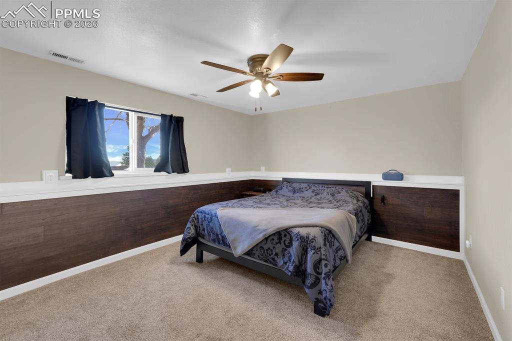 Image 18 of 29: Lower Level Family Room (Used as Bedroom Currently)