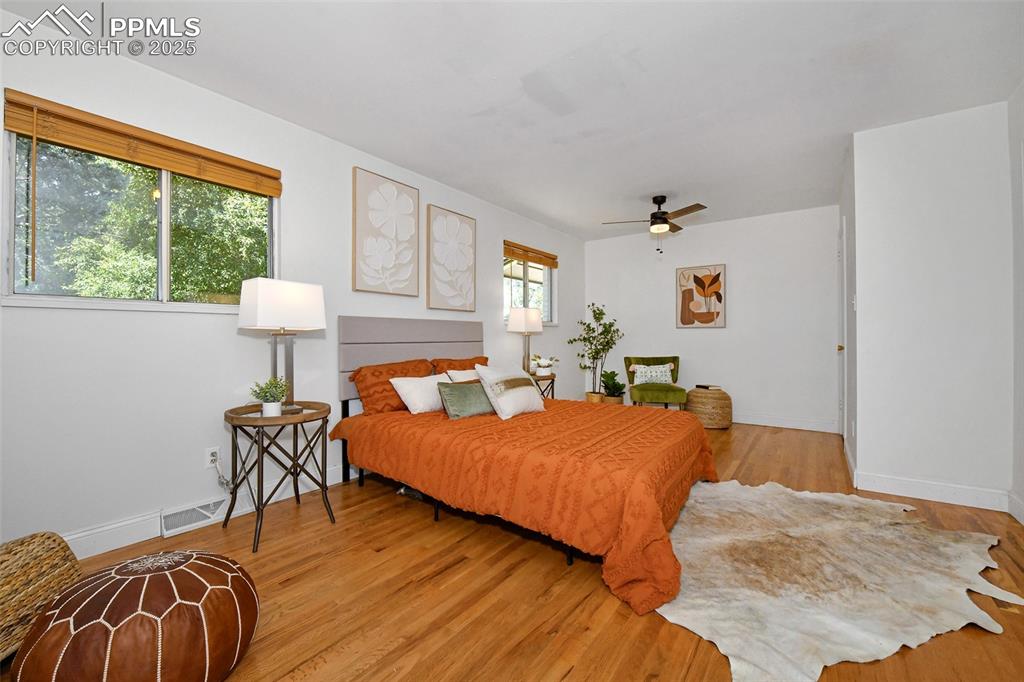 Image 17 of 35: Spacious Primary Bedroom has sitting and dressing areas!