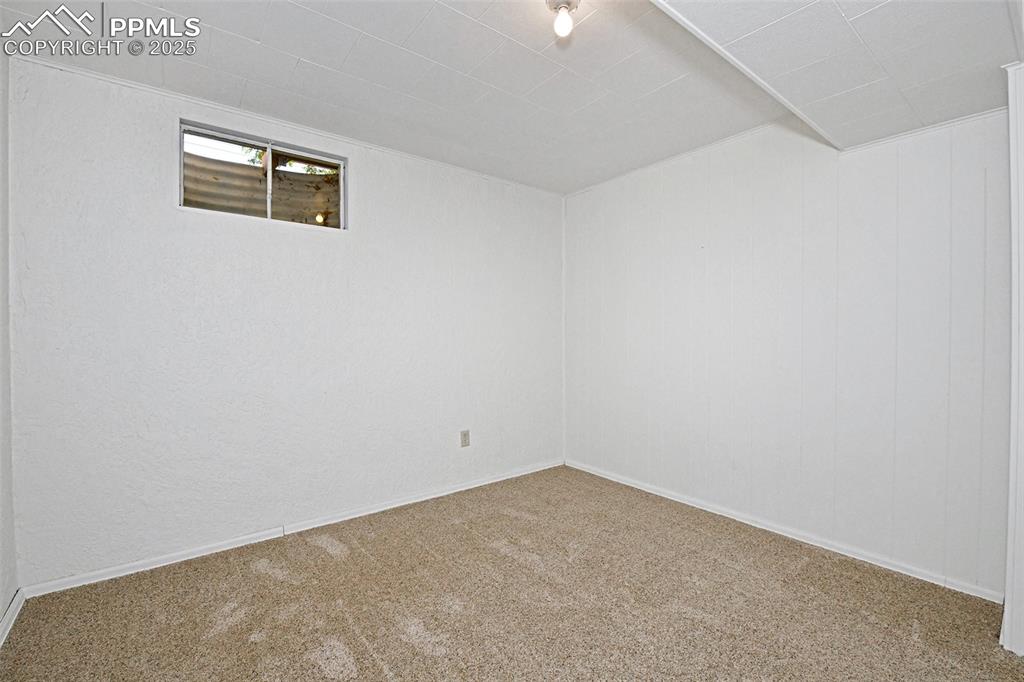 Image 28 of 35: Non-conforming Basement Bedroom