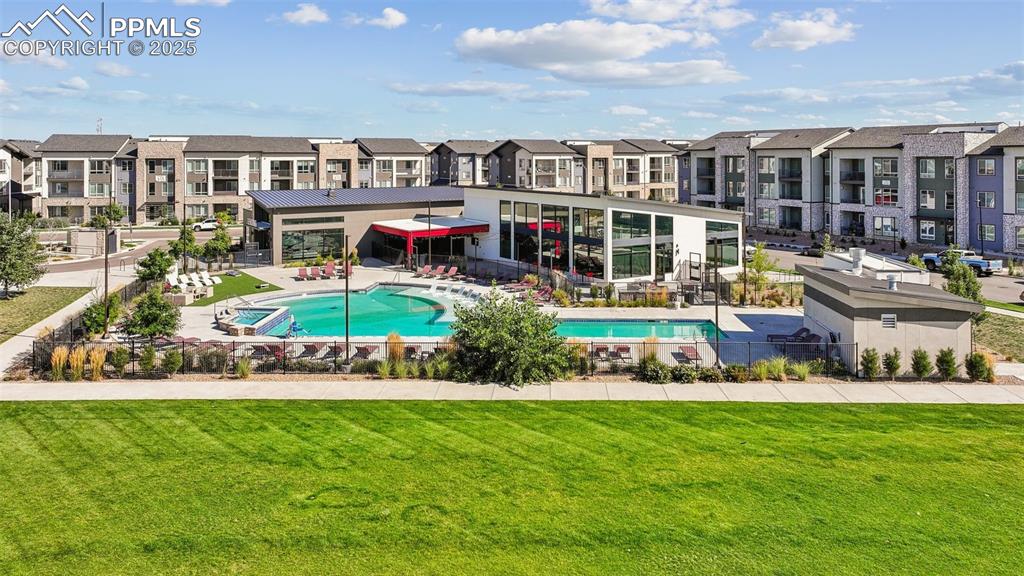 Image 10 of 35: Community pool featuring a patio area and a residential view
