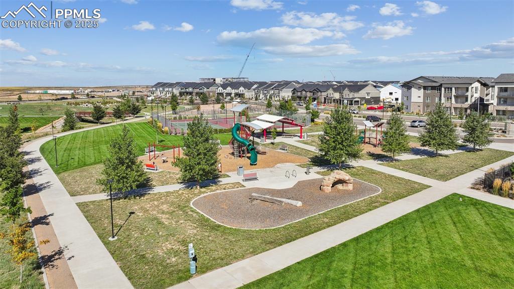 Image 11 of 35: Aerial perspective of suburban area with a community park