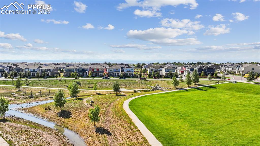 Image 14 of 35: Aerial view of residential area featuring a recreational park
