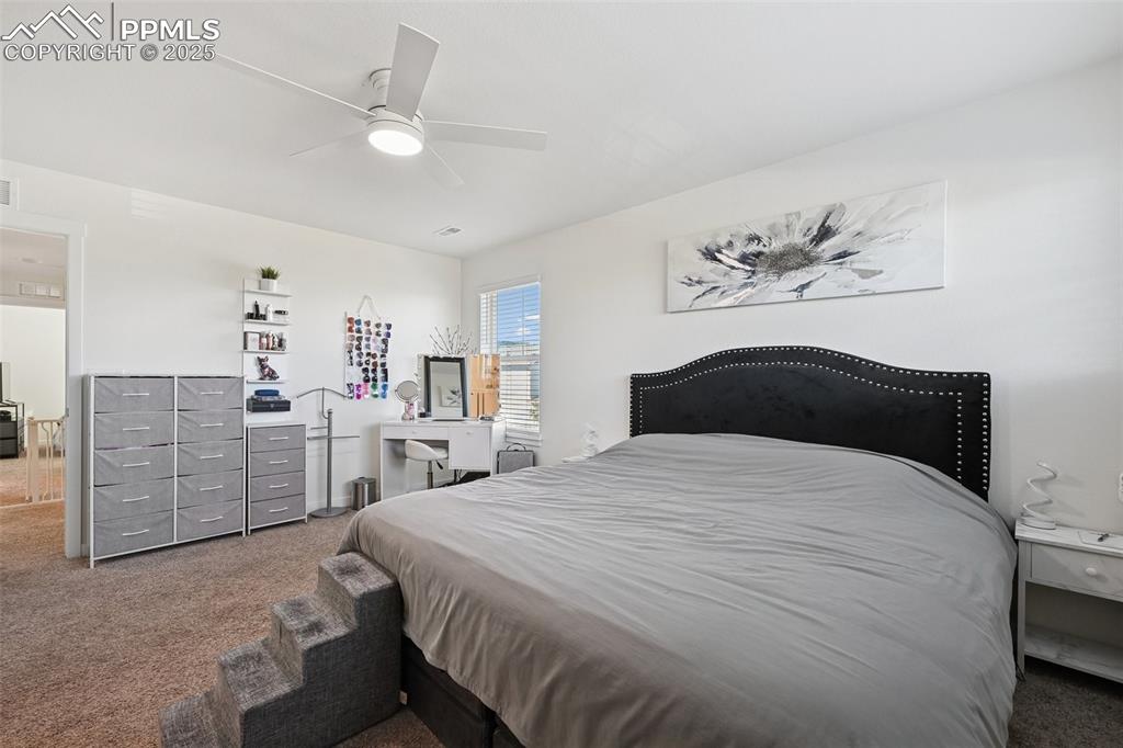 Image 25 of 35: Bedroom featuring carpet and ceiling fan