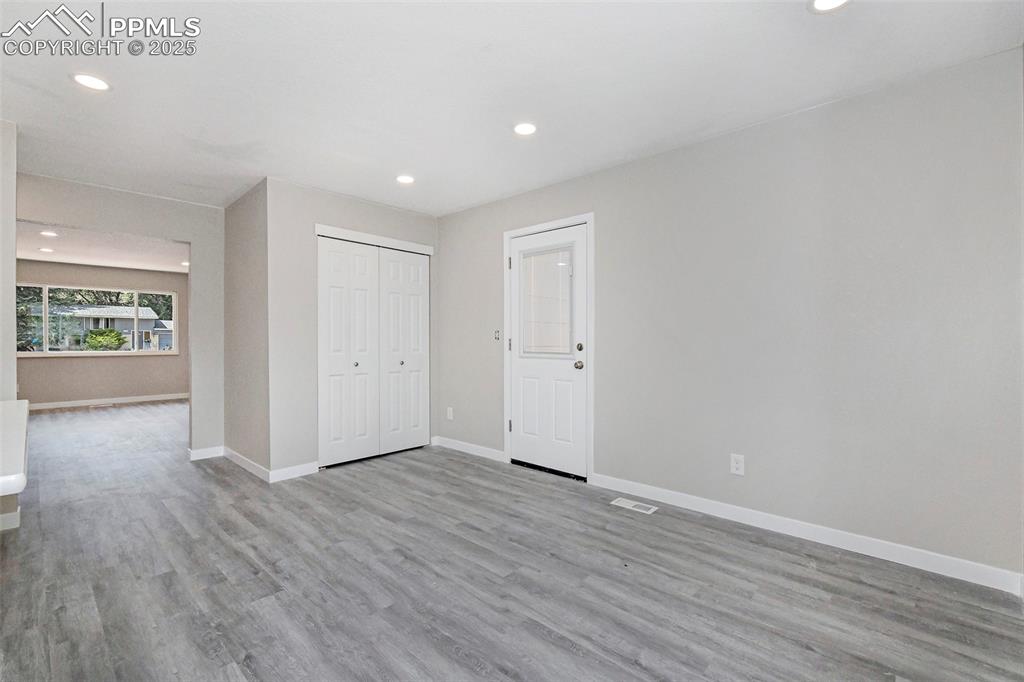 Image 13 of 25: Unfurnished bedroom featuring recessed lighting, light wood finished floors