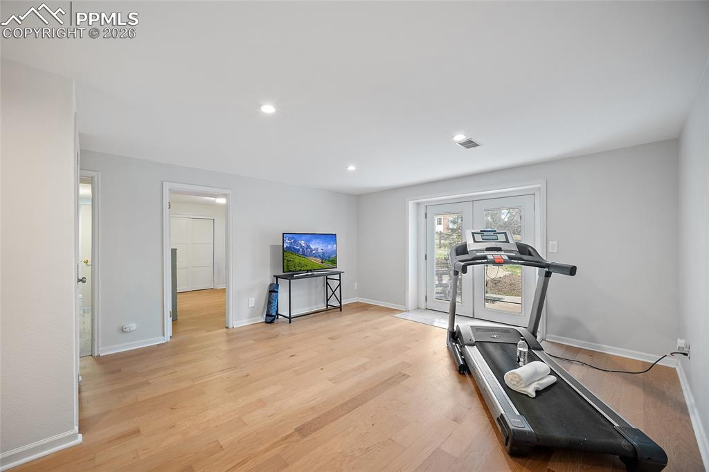 Image 23 of 50: Basement Family Room with walkout.