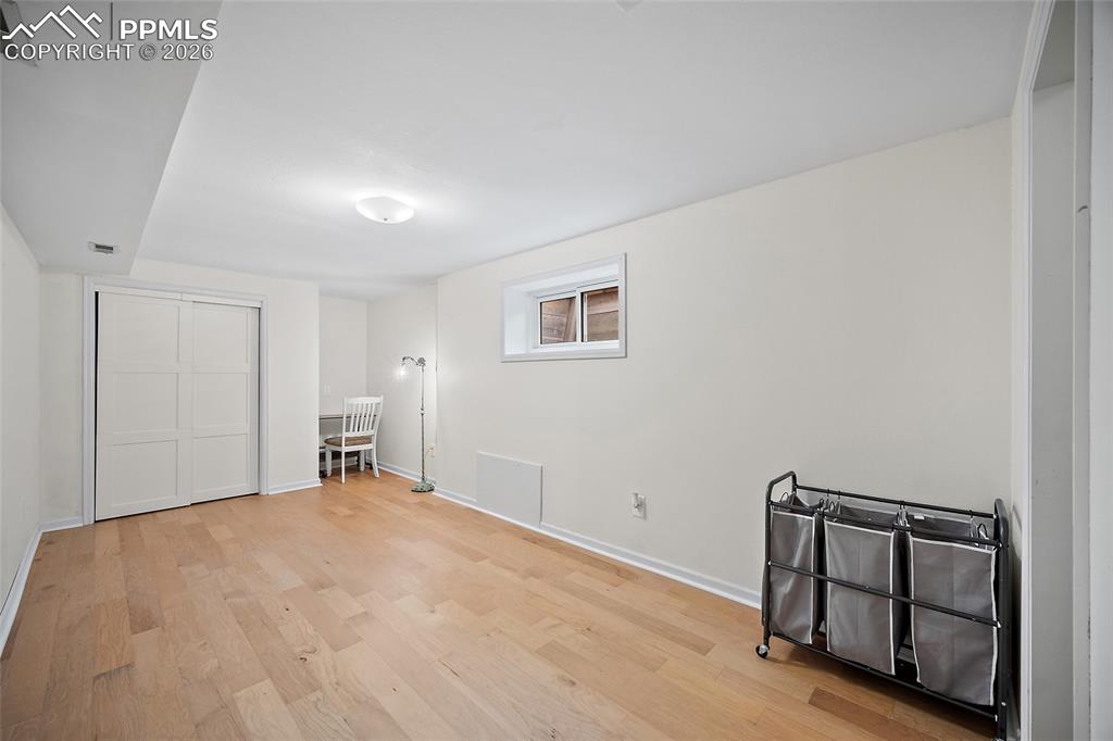 Image 32 of 50: Basement Bedroom
