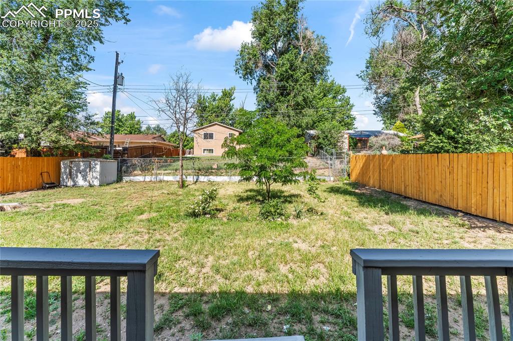 Image 31 of 36: View of fenced backyard
