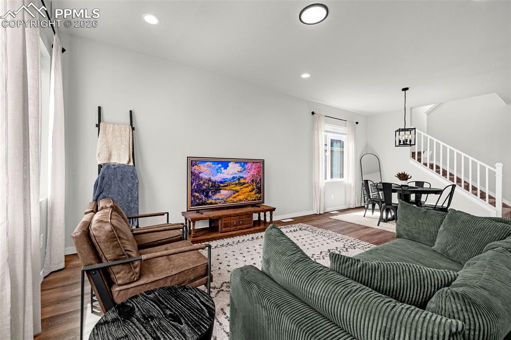 Image 12 of 40: Living room featuring great natural light, luxury vinyl plank flooring and 