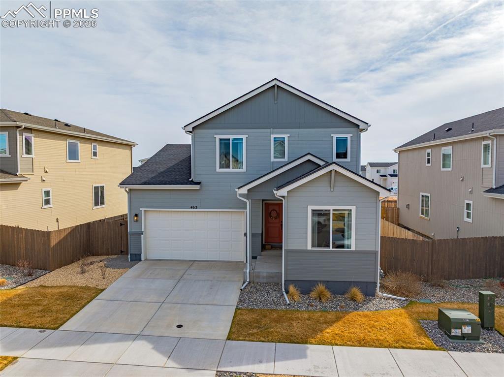 Image 33 of 40: View of front of house with concrete driveway, with 3-car attached tandem g