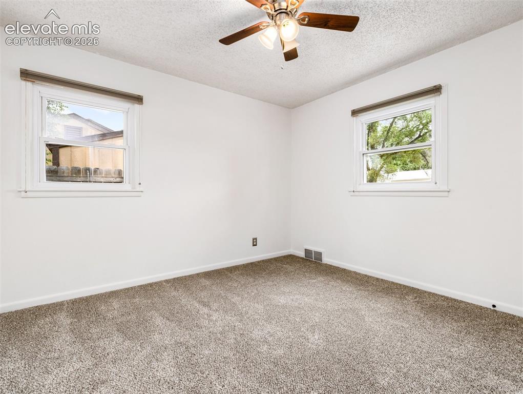 Image 25 of 37: Bedroom 1 has new carpet