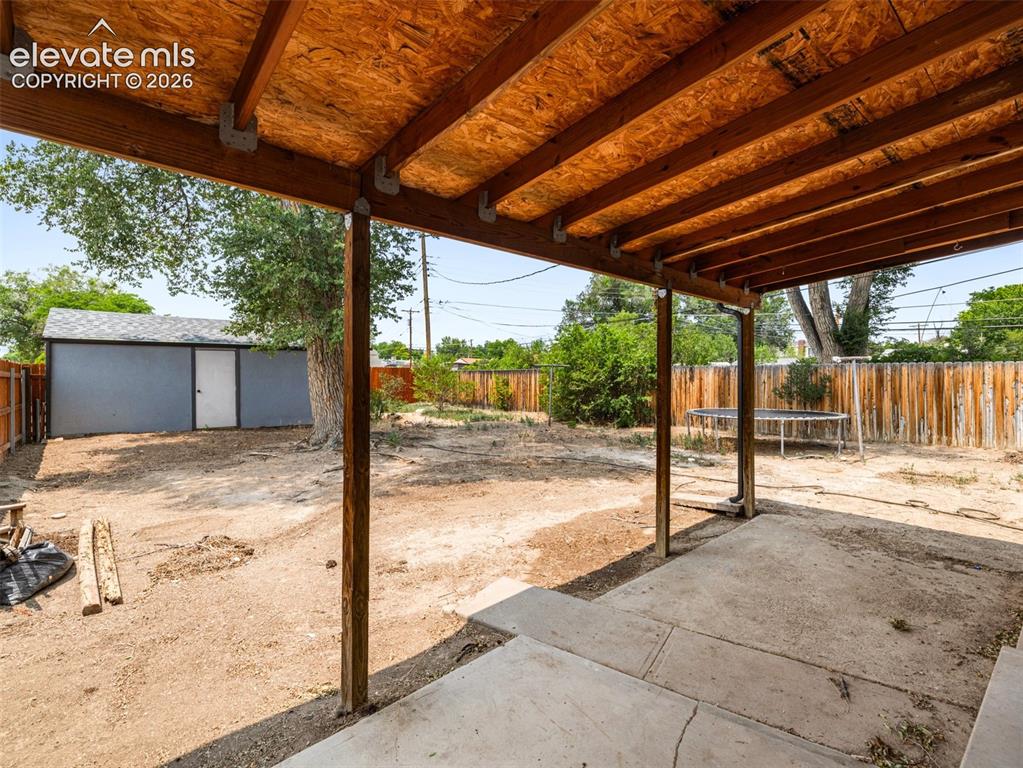 Image 31 of 37: Covered back patios are perfect for morning coffee or evening barbeques!