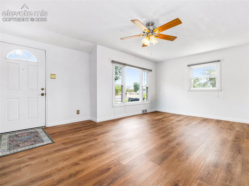 Image 5 of 37: Gorgeous new flooring, fresh paint and natural sunlight adorn this room