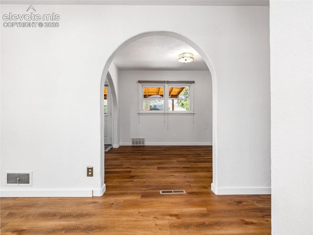 Image 8 of 37: So much charm in this home with the arch ways