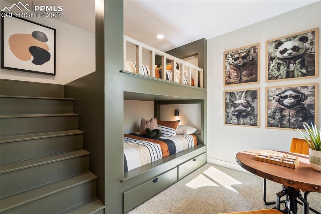 Image 32 of 50: Basement bedroom includes built in full-sized bunk beds.
