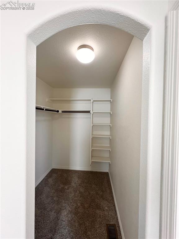 Image 20 of 45: Walk-in Closet