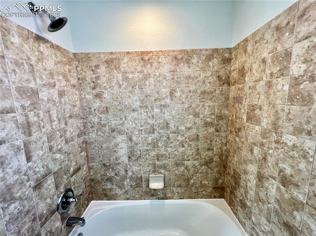 Image 27 of 45: Third Bathroom with tub