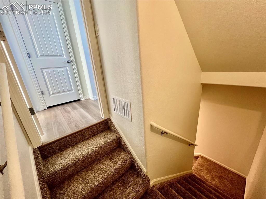 Image 30 of 45: Stairs to the finished basement