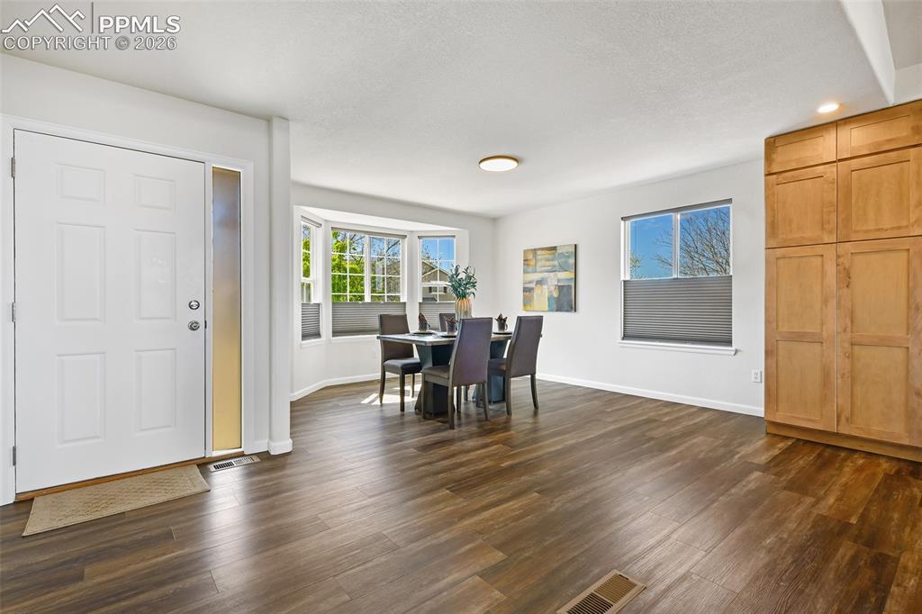 Image 6 of 48: Dining area with bay window off entry