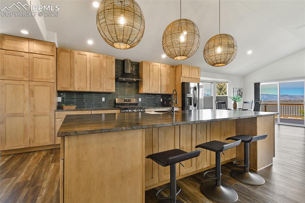 Image 9 of 48: Counter seating, loads of cupboard and cabinet space with soft close drawer
