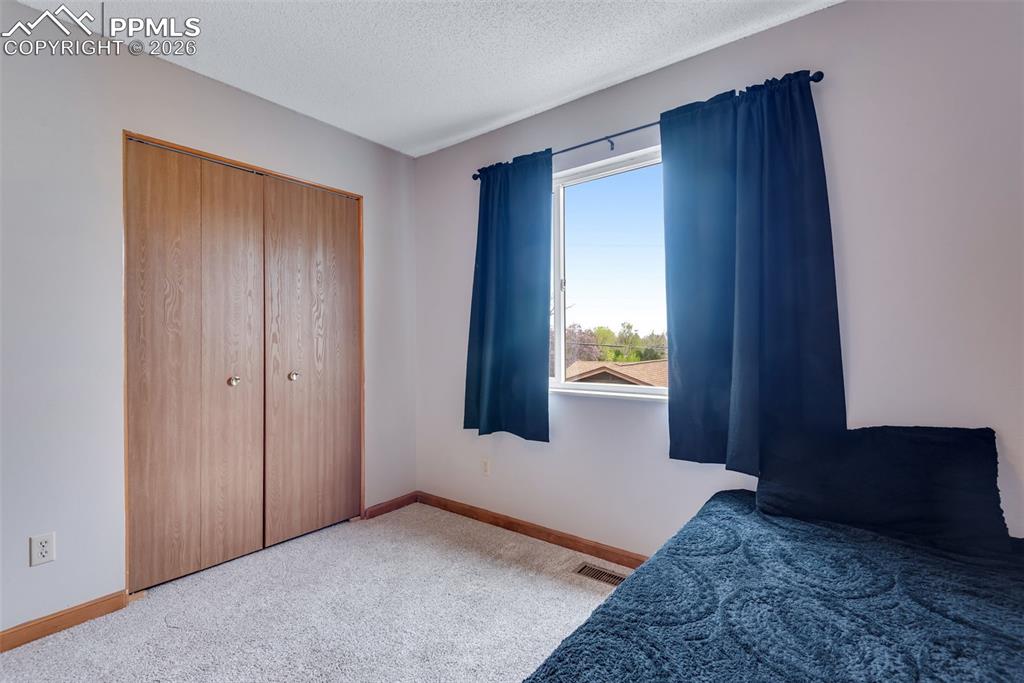 Image 25 of 34: Middle bedroom upstairs