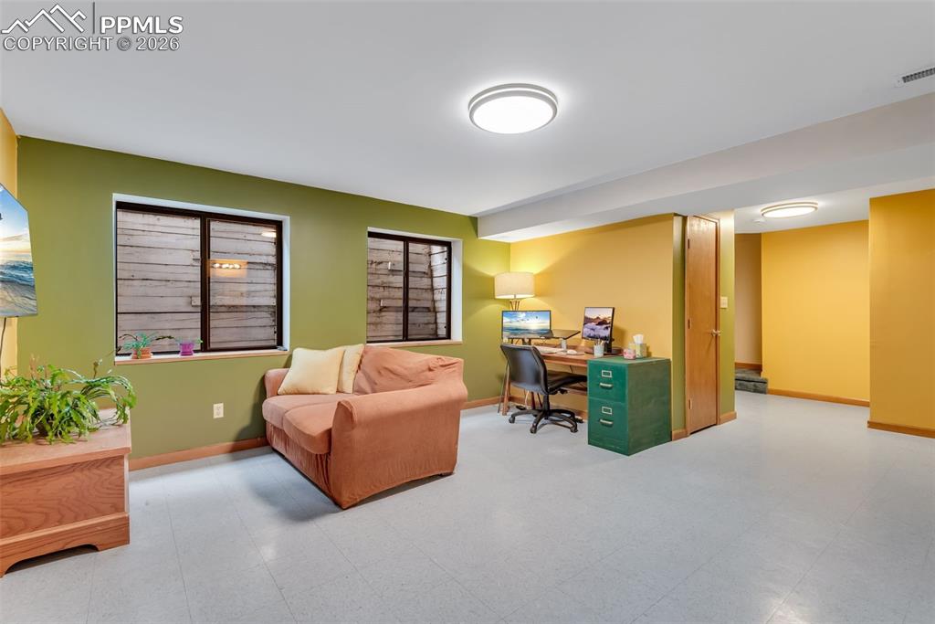 Image 28 of 34: Family room space in the basement