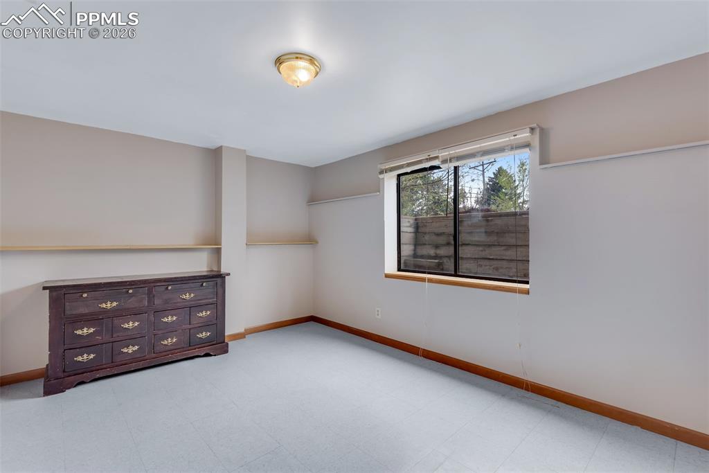 Image 30 of 34: Basement bedroom which could also serve as an office or hobby space